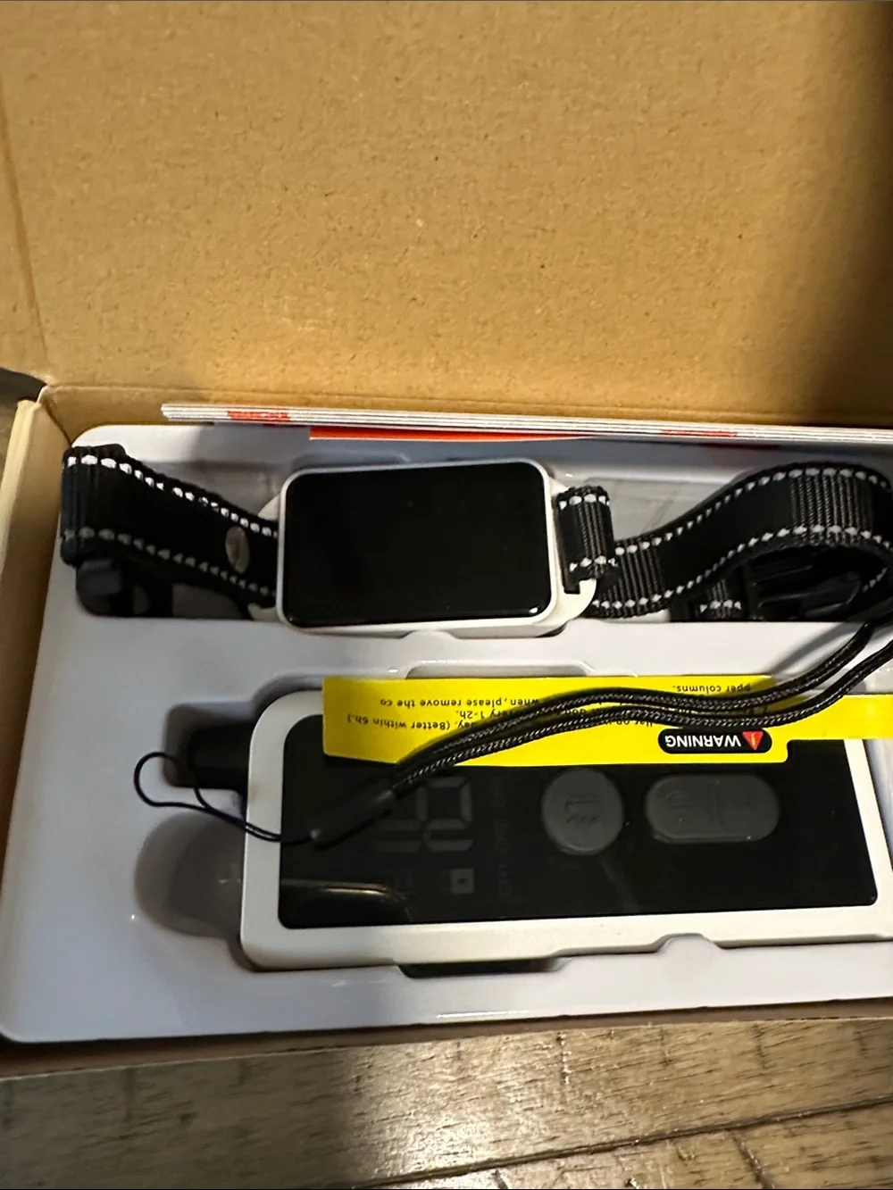 White Body-Mounted Camera Remote with Adjustable Black Strap